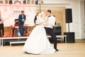 First wedding dance of newlywed couple in restaurant