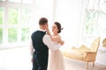 First wedding dance.wedding couple dances on the studio Wedding day. Happy young bride and groom on their wedding day. Royalty Free Stock Photo