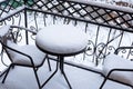 The first white fluffy snow on the table and chairs on the wrought-iron balcony. Fabulous winter