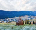 First winter snow and autumn mountain village Royalty Free Stock Photo