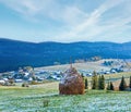 First winter snow and autumn mountain village Royalty Free Stock Photo