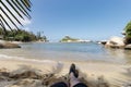 Firts person view of a man relaxing on cabo san juan beach inside colombian tayrona national park