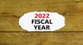 2022 fiscal new year symbol. Words `2022 fiscal year`, on white paper. Beautiful wooden background. Business and 2022 fiscal new