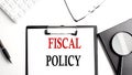 FISCAL POLICY text written on paper clipboard with office tools Royalty Free Stock Photo