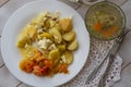 Fish aspic in a transparent bowl with potato