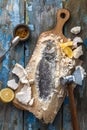 Fish baked in salt with lemon and oil, top view