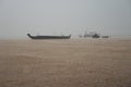 Fish boats on the waves during a storm