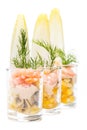 Fish buffet: shrimp cocktails in a row isolated on white background