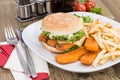 Fish Burger with Chips Royalty Free Stock Photo