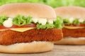 Fish burger fishburger hamburger closeup close up tomatoes lettuce cheese Royalty Free Stock Photo