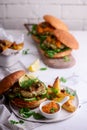 Fish burger with herb and corgette sauce Royalty Free Stock Photo