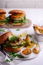 Fish burger with herb and corgette sauce Royalty Free Stock Photo