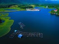 A fish cage in a blue lake