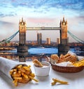 Fish and Chips against Tower Bridge in London, England Royalty Free Stock Photo