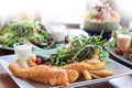 fish and chips Deep fried battered fish on a plate with chips cl Royalty Free Stock Photo