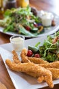 fish and chips Deep fried battered fish on a plate with chips cl Royalty Free Stock Photo
