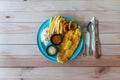 Fish & Chips with french fries, coleslaw and onion rings, western food on flat lay table Royalty Free Stock Photo