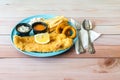 Fish & Chips with french fries, coleslaw and onion rings, western food on table Royalty Free Stock Photo