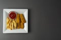 Fish and chips with french fries - unhealthy food, grey backgrpound Royalty Free Stock Photo