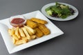 Fish and chips with french fries - unhealthy food, grey backgrpound Royalty Free Stock Photo