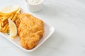 fish and chips - fried fish fillet with potatoes chips Royalty Free Stock Photo