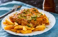 Fish and Chips. Fried fish fillet and potatoes in a white plate Royalty Free Stock Photo