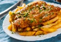 Fish and Chips. Fried fish fillet and potatoes in a white plate Royalty Free Stock Photo