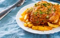 Fish and Chips. Fried fish fillet and potatoes in a white plate Royalty Free Stock Photo