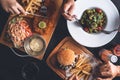 Fish and Chips, Fries and Burger, Pasta Dish on Restaurant Table Royalty Free Stock Photo