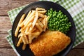 Fish and chips with green peas close-up on a plate. horizontal t Royalty Free Stock Photo
