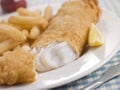 Fish and Chips with Lemon and Tomato Ketchup Royalty Free Stock Photo