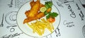 fish and chips meal breaded cod fish fillet with French fries served on plate Royalty Free Stock Photo