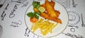 fish and chips meal breaded cod fish fillet with French fries served on plate Royalty Free Stock Photo