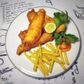 fish and chips meal breaded cod fish fillet with French fries served on plate Royalty Free Stock Photo