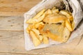 Fish and chips in newspaper, British snack Royalty Free Stock Photo