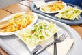 Fish and chips on a plate. Fried fish and french fries on plastic plate in restaurant Royalty Free Stock Photo