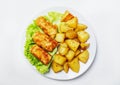 Fish and chips on a plate, white background, top view Royalty Free Stock Photo