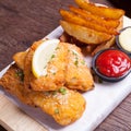 Fish and chips with potato wedge