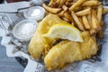 Fish & Chips Served with Fries Royalty Free Stock Photo