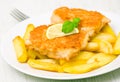 Fish and chips with slice of lemon Royalty Free Stock Photo