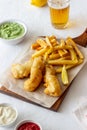 Fish and chips on a white background. British fast food. Recipes. Snack to beer. English cuisine Royalty Free Stock Photo