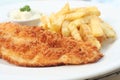 Fish and chips on white plate