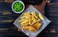 Fish and chips on a wooden background. British fast food. Recipes. Snack to beer. English cuisine