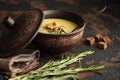 Fish cream soup with Salmon, cheese, Potatoes and herbs in white Soup Bowls