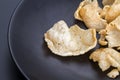 Fish crisp rice cracker on black plate