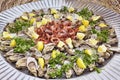 Fish cruditÃÂ©s on serving dish with shrimp and oysters garnished with parsley and fresh lemon