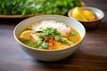 fish curry with lemon slices and cilantro