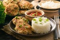 Fish cutlets with broccoli served with boiled rice. Royalty Free Stock Photo