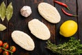 Fish cutlets from minced cod, on old dark  wooden table background, top view flat lay Royalty Free Stock Photo
