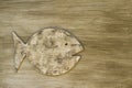 Fish deocoration made of wood on the wooden background. Summer s